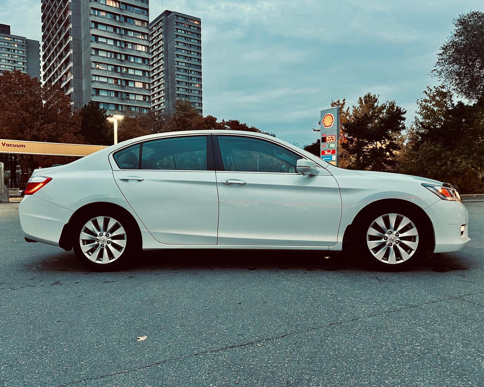 A sedan parked in a scenic location for daily use